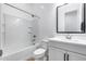 Clean bathroom with a tub/shower combination, vanity, toilet, and neutral finishes at 4606 S Ferric --, Mesa, AZ 85212