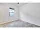 Bright bedroom with neutral walls, plush carpet, and a window providing natural light at 4606 S Ferric --, Mesa, AZ 85212