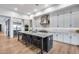 Modern kitchen with an oversized island, stainless steel appliances, and gray cabinets at 4606 S Ferric --, Mesa, AZ 85212