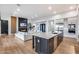 Open-concept kitchen and living area with hardwood flooring and modern appliances at 4606 S Ferric --, Mesa, AZ 85212