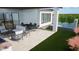 Relaxing patio area featuring comfortable seating, dining area, and outdoor kitchen at 4606 S Ferric --, Mesa, AZ 85212