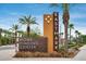 Attractive community signage with manicured landscaping and palm trees at 4606 S Ferric --, Mesa, AZ 85212