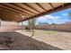 Spacious backyard features a gravel area, covered patio, and privacy fence for outdoor enjoyment at 5431 W Sierra St, Glendale, AZ 85304