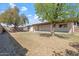 Lush backyard with mature trees providing shade on a sunny day at 5431 W Sierra St, Glendale, AZ 85304