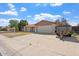 Lovely house featuring a long driveway with a two-car garage and mature trees at 5431 W Sierra St, Glendale, AZ 85304