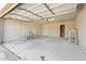Spacious garage with ample storage space, ladder, and a large door for functionality at 5431 W Sierra St, Glendale, AZ 85304