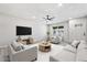 Comfortable living room featuring a neutral color palette, modern furnishings, and a ceiling fan at 5431 W Sierra St, Glendale, AZ 85304