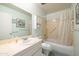 Bathroom with a vanity, sink, and a shower-tub combination at 5525 E Thomas Rd # N5, Phoenix, AZ 85018