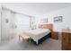 Comfortable bedroom with a queen bed, side tables, and natural light from the window at 5525 E Thomas Rd # N5, Phoenix, AZ 85018