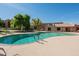 Inviting swimming pool surrounded by lush landscaping and lounge chairs for relaxation at 5525 E Thomas Rd # N5, Phoenix, AZ 85018