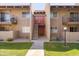Exterior view of the apartment complex with sidewalks, stairs, and some grassy areas at 5525 E Thomas Rd # N5, Phoenix, AZ 85018