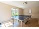 Well-lit game room with a ping pong table, offering recreational opportunities for residents at 5525 E Thomas Rd # N5, Phoenix, AZ 85018
