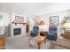 Cozy living room features a fireplace and comfortable seating arrangement at 5525 E Thomas Rd # N5, Phoenix, AZ 85018