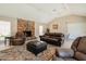 Resident clubhouse with brick fireplace, leather seating, and vaulted ceilings at 5525 E Thomas Rd # N5, Phoenix, AZ 85018