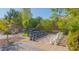 Giant outdoor chess set on a tiled patio, surrounded by mature trees and garden features at 560 S 197Th Ave, Buckeye, AZ 85326