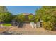 Landscaped backyard featuring a giant chess set on a tiled patio, perfect for outdoor entertainment at 560 S 197Th Ave, Buckeye, AZ 85326