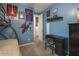 Bedroom with a bunk bed, blue walls with superhero art, and a desk area at 560 S 197Th Ave, Buckeye, AZ 85326
