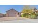 Charming single-story home with a brick-paved driveway and well-manicured landscaping at 560 S 197Th Ave, Buckeye, AZ 85326