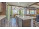 Bright kitchen with an island, modern appliances, wooden cabinets, and view to an open floorplan at 560 S 197Th Ave, Buckeye, AZ 85326