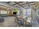 Open living and dining area with wood-look floors, wooden beams, and comfortable seating at 560 S 197Th Ave, Buckeye, AZ 85326