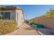 Side yard with raised garden beds and desert landscaping behind the home at 560 S 197Th Ave, Buckeye, AZ 85326