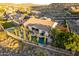 Aerial view of a beautiful backyard featuring a pool, well-placed patio seating, and meticulous landscaping at 6022 W Fetlock Trl, Phoenix, AZ 85083