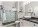 Bright bathroom featuring a vanity with a granite countertop, a toilet, and a glass-enclosed shower at 6022 W Fetlock Trl, Phoenix, AZ 85083