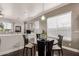 Modern dining room with a round table, stylish chairs, and natural light at 6022 W Fetlock Trl, Phoenix, AZ 85083