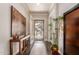 Elegant foyer with dark wood floors, console table, and decorative accents at 6022 W Fetlock Trl, Phoenix, AZ 85083