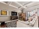 Cozy living room featuring a fireplace, large windows, and comfortable seating at 6022 W Fetlock Trl, Phoenix, AZ 85083
