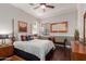 Cozy main bedroom featuring hardwood floors and warm colors at 6022 W Fetlock Trl, Phoenix, AZ 85083