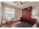 Functional home office featuring a Murphy bed and desk at 6022 W Fetlock Trl, Phoenix, AZ 85083