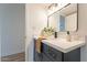Modern bathroom featuring updated vanity, a framed mirror, and sleek fixtures at 6565 N 19Th Ave # 59, Phoenix, AZ 85015