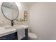 Bright bathroom with a new countertop and round mirror, complemented by stylish decor and fixtures at 6565 N 19Th Ave # 59, Phoenix, AZ 85015