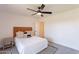 Bright bedroom with a stylish leather headboard, ceiling fan, and modern decor at 6565 N 19Th Ave # 59, Phoenix, AZ 85015