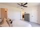 This bedroom offers a ceiling fan, carpet flooring, and an ensuite bathroom at 6565 N 19Th Ave # 59, Phoenix, AZ 85015