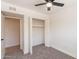 Neutral bedroom featuring a ceiling fan, a closet, and a neutral color palette at 6565 N 19Th Ave # 59, Phoenix, AZ 85015
