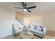 Cozy living room featuring modern decor, wood-look flooring, and staircase at 6565 N 19Th Ave # 59, Phoenix, AZ 85015