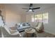 Inviting living room with stylish furniture and large window with a view of the complex at 6565 N 19Th Ave # 59, Phoenix, AZ 85015