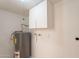 Small utility room with a water heater and storage at 6565 N 19Th Ave # 59, Phoenix, AZ 85015