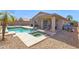 Beautiful backyard features an outdoor swimming pool, covered patio and pristine landscaping at 6904 W Golden Ln, Peoria, AZ 85345