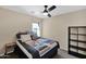Stylish bedroom design featuring dark wooden accents and neutral paint to create a calming atmosphere at 6904 W Golden Ln, Peoria, AZ 85345