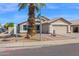 Attractive home featuring desert landscaping, a two-car garage, and a covered entryway at 6904 W Golden Ln, Peoria, AZ 85345