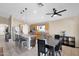 Bright kitchen featuring wooden cabinets, stainless steel appliances, an island with seating, and a dining table at 6904 W Golden Ln, Peoria, AZ 85345
