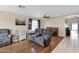 Cozy living room features hardwood floors, neutral walls, and comfortable seating area at 6904 W Golden Ln, Peoria, AZ 85345
