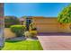 Beautiful home featuring a 2-car garage, well-manicured lawn, and a second-story balcony, enhancing its curb appeal at 7330 E Palo Verde Dr # 1, Scottsdale, AZ 85250