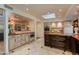 A spacious kitchen boasts custom cabinetry, a center island, and seamless access to adjacent areas at 7330 E Palo Verde Dr # 1, Scottsdale, AZ 85250