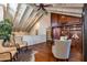 An elegant living room features vaulted ceilings, custom built-ins, and ample natural light at 7330 E Palo Verde Dr # 1, Scottsdale, AZ 85250