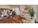 Open living area with hardwood floors, stylish seating, and a bar area, perfect for entertaining guests at 7330 E Palo Verde Dr # 1, Scottsdale, AZ 85250