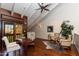 Office showcasing a vaulted ceiling, wood floors, and a private balcony for relaxation at 7330 E Palo Verde Dr # 1, Scottsdale, AZ 85250